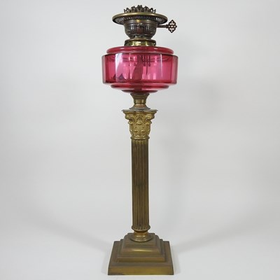 Lot 124 - A brass column oil lamp