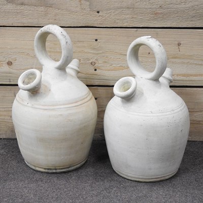 Lot 212 - A pair of pottery ewers