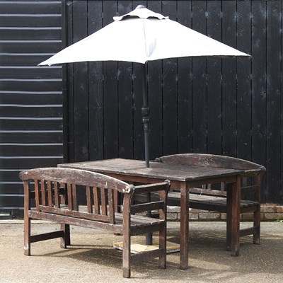 Lot 355 - A garden table and benches
