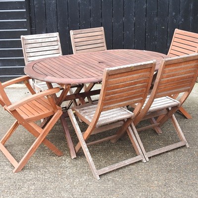 Lot 354 - A garden table and chairs