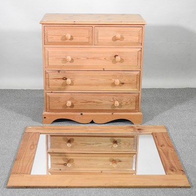 Lot 378 - A pine chest and a mirror