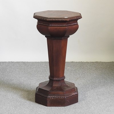 Lot 151 - A carved oak pedestal