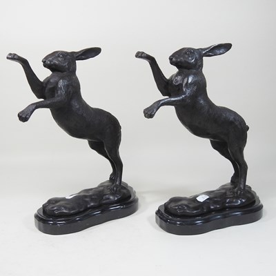 Lot 106 - A pair of bronze models of boxing hares
