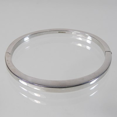 Lot 24 - A modern 9 carat white gold bangle