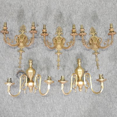 Lot 176 - A set of three gilt brass twin branch wall lights