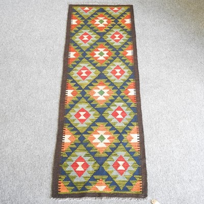 Lot 504 - A kilim runner