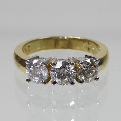 Lot 45 - An 18 carat three stone diamond ring