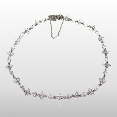 Lot 61 - An 18 carat white gold and diamond line bracelet