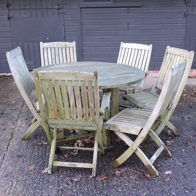Lot 23 - A teak garden table