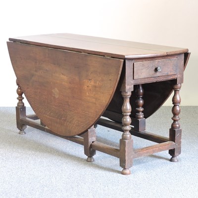 Lot 520 - An 18th century oak gateleg table