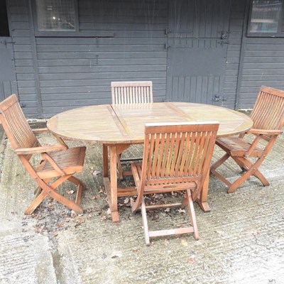 Lot 11 - A teak extending garden table