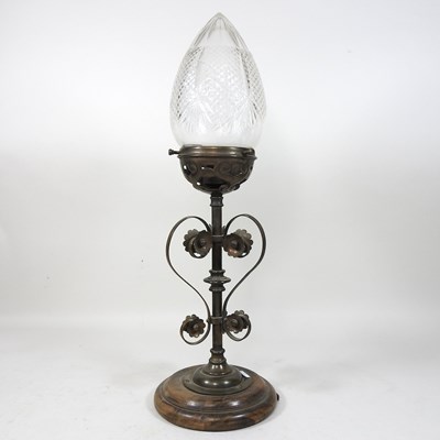 Lot 213 - An unusual early 20th century brass newel post lamp