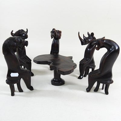 Lot 460 - An African miniature table and chairs
