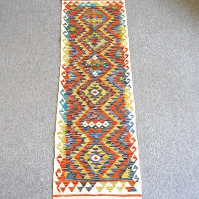 Lot 504 - A Kilim runner