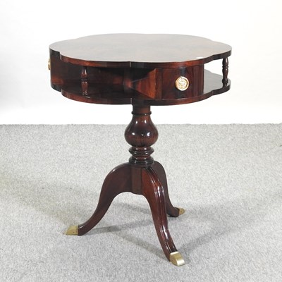 Lot 473 - A reproduction drum table