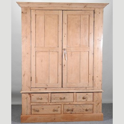 Lot 76 - An antique pine wardrobe