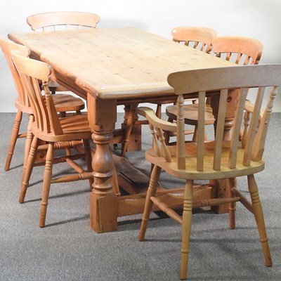Lot 599 - A pine dining table, on turned legs, together...