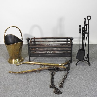 Lot 612 - A cast iron fire basket, together with brass...