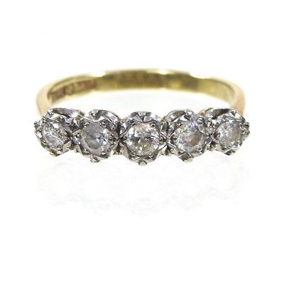 Lot 67 - An 18 carat gold and platinum set five stone...