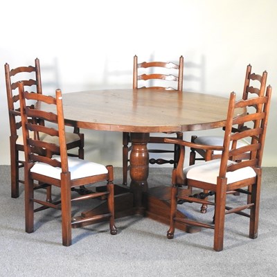 Lot 105 - An oak circular dining table, 147cm diameter,...