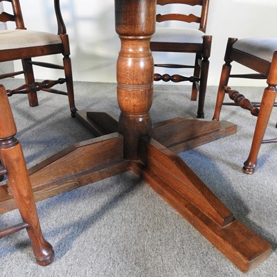Lot 105 - An oak circular dining table, 147cm diameter,...