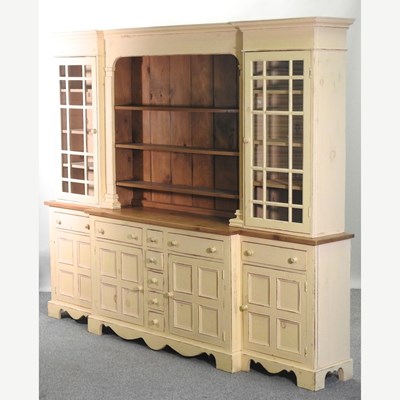 Lot 35 - A large 20th century cream painted and pine breakfront dresser