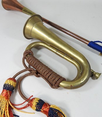 Lot 135 - A brass hunting horn, 73cm long, together with...