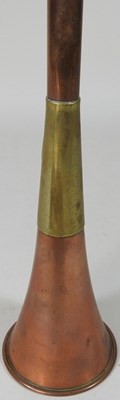 Lot 135 - A brass hunting horn, 73cm long, together with...
