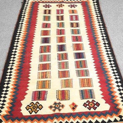 Lot 373 - A Persian qashqai kilim, with coloured squares,...
