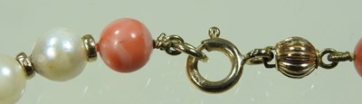 Lot 99 - A coral and cultured pearl bead necklace, with...
