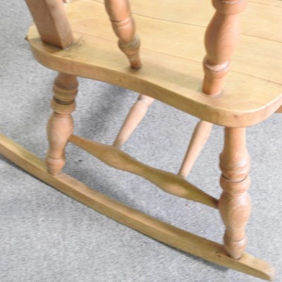 Lot 190 - A beech splat back rocking chair