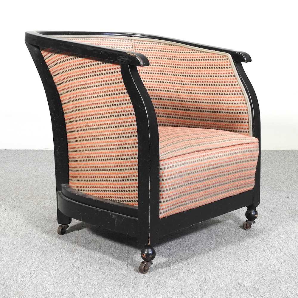 Lot 75 - An Art Deco ebonised tub shaped armchair