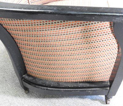 Lot 75 - An Art Deco ebonised tub shaped armchair