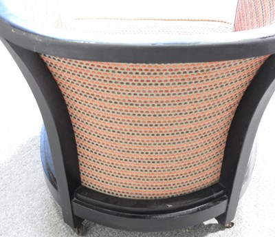 Lot 75 - An Art Deco ebonised tub shaped armchair