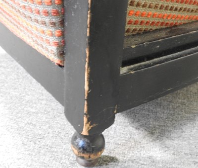 Lot 75 - An Art Deco ebonised tub shaped armchair