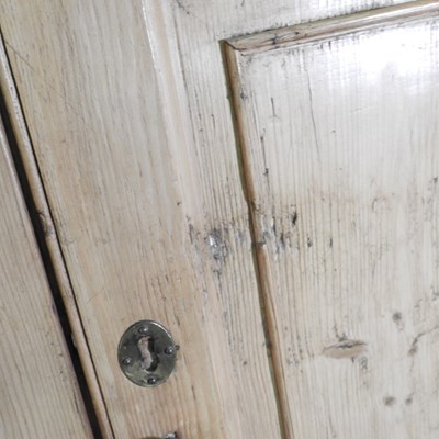 Lot 138 - An antique pine barrel back standing corner...