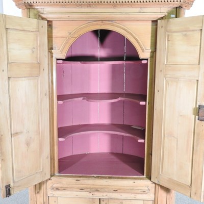 Lot 138 - An antique pine barrel back standing corner...