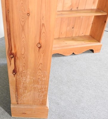 Lot 133 - A pair of pine standing open bookcases, each...