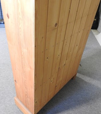 Lot 133 - A pair of pine standing open bookcases, each...