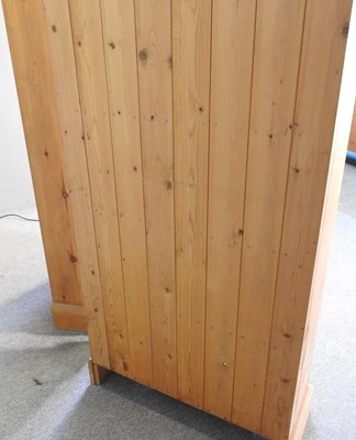 Lot 133 - A pair of pine standing open bookcases, each...