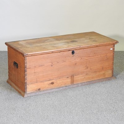 Lot 100 - An antique pine box, with a hinged lid,...