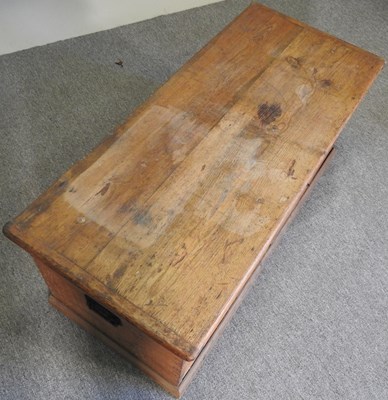 Lot 100 - An antique pine box, with a hinged lid,...