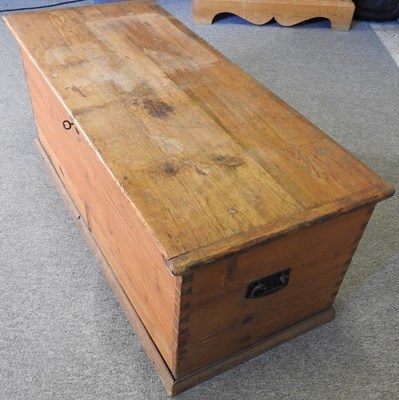 Lot 100 - An antique pine box, with a hinged lid,...