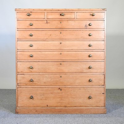 Lot 6 - An early 20th century pine chest, containing...