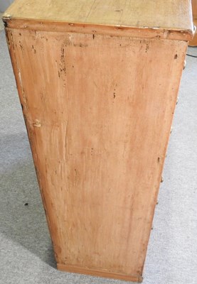 Lot 6 - An early 20th century pine chest, containing...