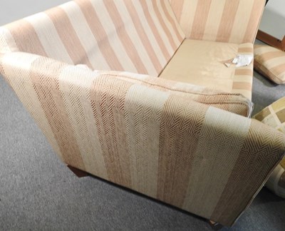 Lot 66 - A modern gold striped upholstered sofa, with...