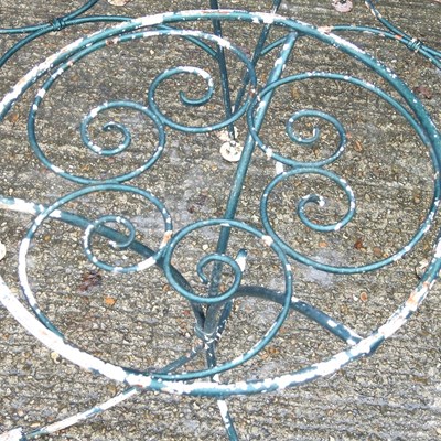 Lot 51 - A metal garden table and pair of chairs (3)