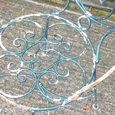 Lot 51 - A metal garden table and pair of chairs (3)