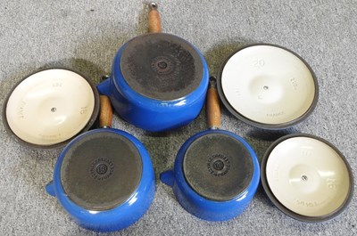 Lot 16 - A set of three graduated Le Creuset saucepans,...