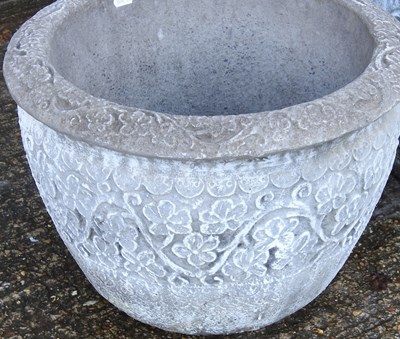 Lot 166 - A reconstituted stone garden pot, together...